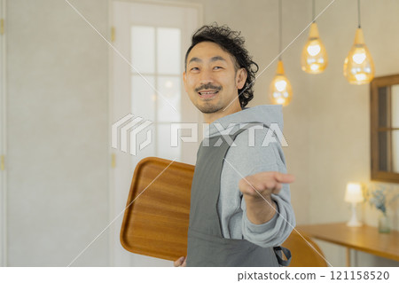 A man working at a cafe A man working at a cafe 121158520