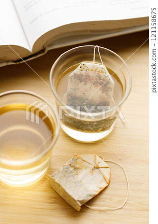 glass of hot tea and tea bag 121158675