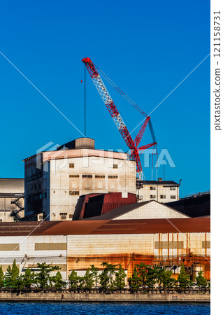 Morning view of Kitakyushu factory (Nippon Steel Kyushu Steel Works) near Matsuyama sightseeing ferry terminal [Kitakyushu City, Fukuoka Prefecture] 121158731