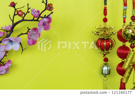 Chinese New Year decoration with on yellow cover background with customizable space for text. Chinese New Year celebration concept 121160177