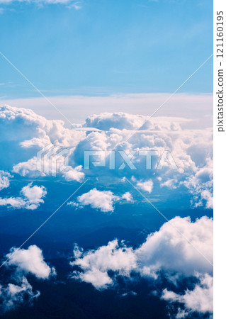 Blue sky and clouds seen from a low altitude Blue sky and clouds seen from a low altitude 121160195