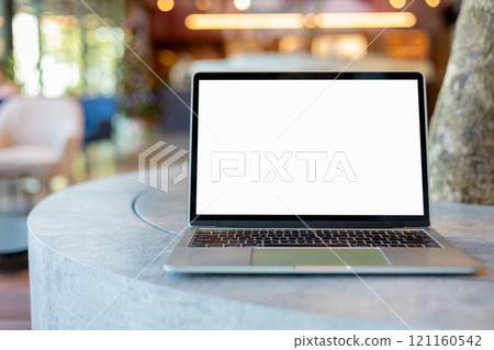 Workspace background new project on laptop computer with blank copy space screen for your advertising text message. Laptop with blank screen and placed on a wooden table inside a coffee shop. Workspace background new project on laptop computer with blank copy space screen for your advertising text message. Laptop with blank screen and placed on a wooden table inside a coffee shop. 121160542