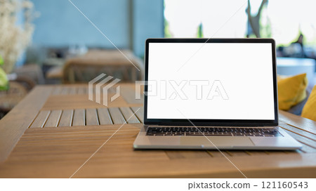 Workspace background new project on laptop computer with blank copy space screen for your advertising text message. Laptop with blank screen and placed on a wooden table inside a coffee shop. Workspace background new project on laptop computer with blank copy space screen for your advertising text message. Laptop with blank screen and placed on a wooden table inside a coffee shop. 121160543