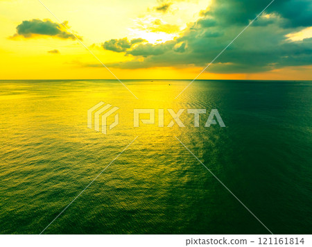 Beautiful Light Sunset or sunrise over sea,Colorful dramatic majestic scenery sunset Sky, Amazing clouds and small waves in the ocean, Wonderful light cloud background 121161814