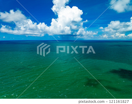 Aerial view of blue sea surface water texture background,Amazing sun reflections Aerial flying drone view Waves water surface texture on sunny tropical ocean Aerial view of blue sea surface water texture background,Amazing sun reflections Aerial flying drone view Waves water surface texture on sunny tropical ocean 121161827