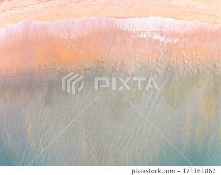 Amazing Top view colorful pink sand beach landscape background,Summer sea waves crashing on sandy shore seascape background,High angle view ocean nature beach background 121161862