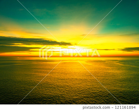 Beautiful Light Sunset or sunrise over sea,Colorful dramatic majestic scenery sunset Sky, Amazing clouds and small waves in the ocean, Wonderful light cloud background 121161894