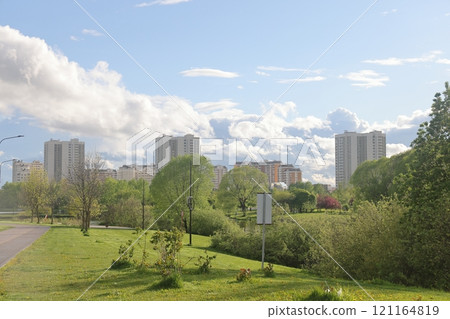 Lush greenery of trees and lawns in the park, urban landscape park. Lush greenery of trees and lawns in the park, urban landscape park. 121164819
