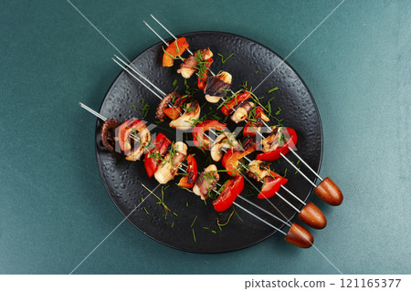 Exotic grilled octopus skewers. 121165377
