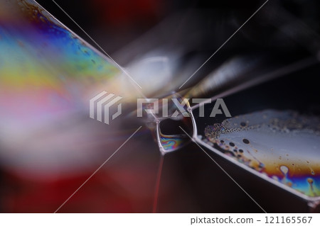 Bright rainbow reflection of liquid, black background, blur colours, surrealistic background, fantastic smooth movement Bright rainbow reflection of liquid, black background, blur colours, surrealistic background, fantastic smooth movement 121165567