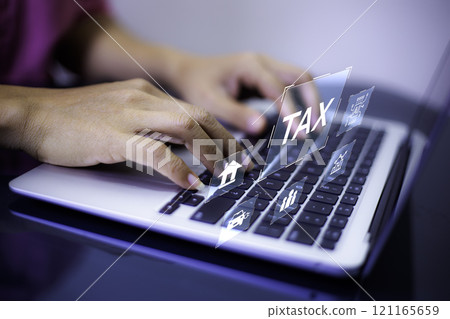 income tax concept. Businessman using laptop analyzing data to online income tax form. tax system icon around. pay online income tax. futuristic virtual screen interface technology. income tax concept. Businessman using laptop analyzing data to online income tax form. tax system icon around. pay online income tax. futuristic virtual screen interface technology. 121165659
