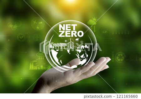 Net zero, carbon neutrality concept. Net zero icon at on hand green blur background. Green Energy Renewable Sustainable ( ESG ). Net zero emission Idea innovative. carbon neutrality in 2050. 121165660