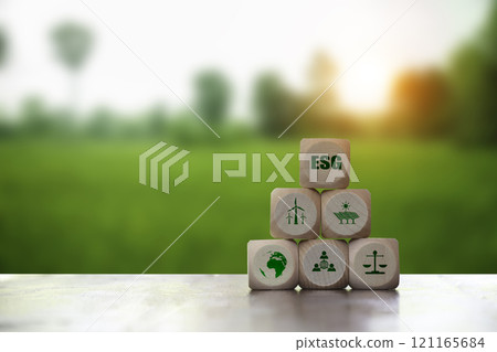 ESG, Renewable energy concept. Icon on white wood at green background. Environmental, social,Governance. Net zero emissions. Carbon credits. ESG, Renewable energy concept. Icon on white wood at green background. Environmental, social,Governance. Net zero emissions. Carbon credits. 121165684