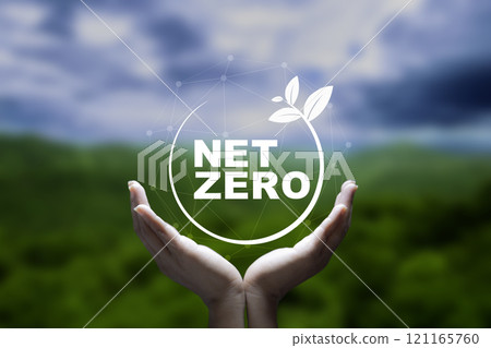 Net zero, carbon neutrality concept. Net zero icon at on hand green blur background. Green Energy Renewable Sustainable ( ESG ). Net zero emission Idea innovative. carbon neutrality in 2050. 121165760
