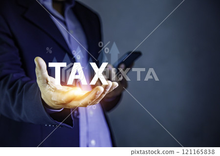 Tax increase concept. tax icon in hand. Pay online income tax. futuristic virtual screen interface technology. Tax increase concept. tax icon in hand. Pay online income tax. futuristic virtual screen interface technology. 121165838
