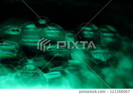 Green liquid phenomenal minimalistic structure, cold green liquid flow on the dark background, colourful abstract, surrealistic art, line of light 121166067