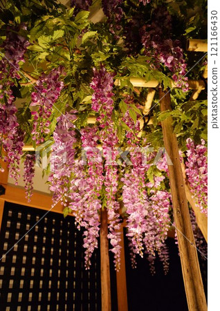 Lighted-up wisteria trellis 121166430