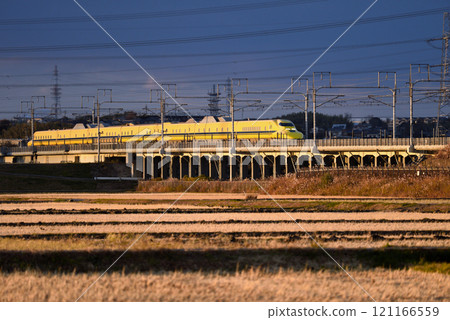 The doctor rushes east in the setting sun 121166559