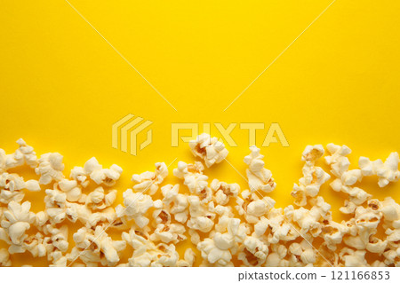 Popcorn on yellow background with copy space 121166853