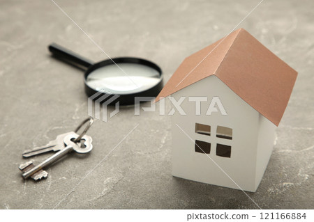 Paper house and key on grey background with copy space. 121166884