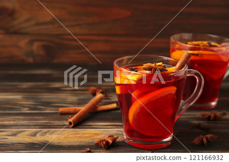 Mulled wine with cinnamon and anise stars on brown background. Thanksgiving Day 121166932