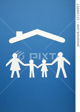 Happy paper family with roof on blue background with copy space. Family day. Vertical photo. Happy paper family with roof on blue background with copy space. Family day. Vertical photo. 121166957