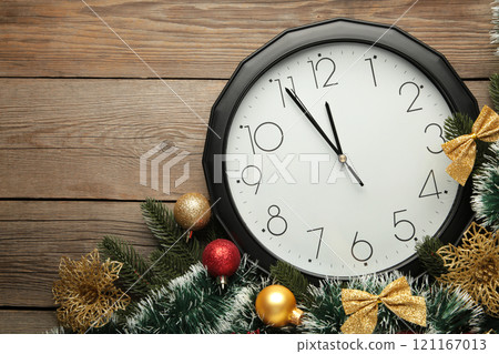 Christmas clock with christmas decoration on grey wooden background. Happy new year concept. 121167013