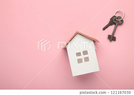 Paper house and key on pink background with copy space. 121167030