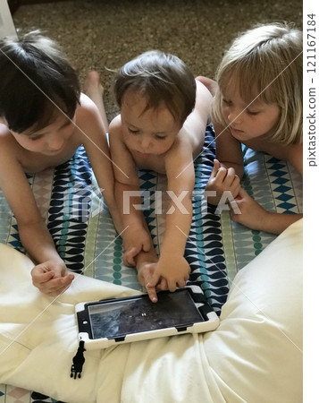 Home, tablet and relax family children watch video, subscription movie or streaming cartoon film, media or web app. Gaming friends, playing online games Home, tablet and relax family children watch video, subscription movie or streaming cartoon film, media or web app. Gaming friends, playing online games 121167184