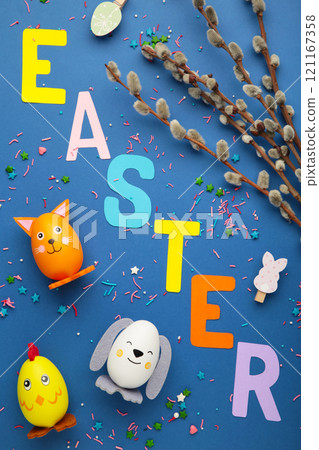 Inscription Easter on blue background, a rope with clothespins. The concept of postcards for the Easter holiday. Vertical photo. Inscription Easter on blue background, a rope with clothespins. The concept of postcards for the Easter holiday. Vertical photo. 121167358