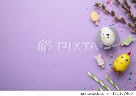 Easter holiday concept with cute handmade eggs, chicks and bunny on purple background. 121167460