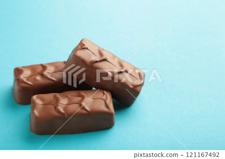 Chocolate bars on blue background. Top view. Chocolate bars on blue background. Top view. 121167492