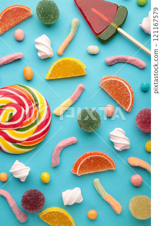 Colorful candies lollipops and jelly on pink background. Top view. Sweets background Colorful candies lollipops and jelly on pink background. Top view. Sweets background 121167579