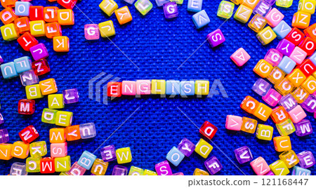 colorful blocks with ENGLISH text on blue background, language learning concept colorful blocks with ENGLISH text on blue background, language learning concept 121168447