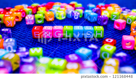 colorful blocks with ENGLISH text on blue background, language learning concept colorful blocks with ENGLISH text on blue background, language learning concept 121168448