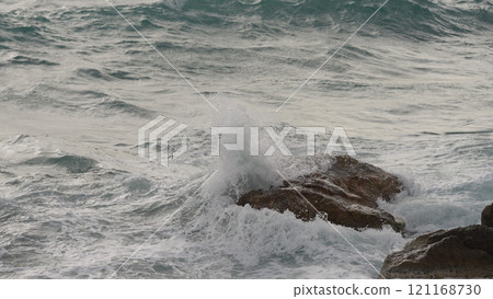 stormy Mediterranean sea waves crushing over rocks stormy Mediterranean sea waves crushing over rocks 121168730