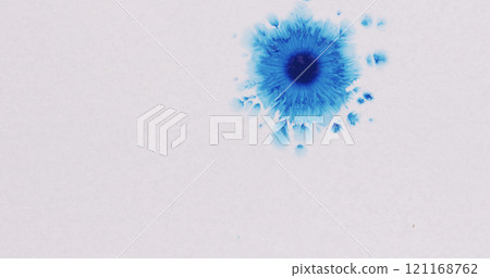 blue ink drops spreads on white wet paper 121168762