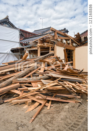 Scrap materials collected from the demolition of an old wooden house 121168886