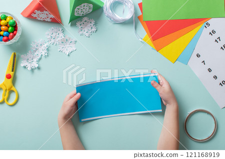 Advent calendar made of colored paper. Step-by-step instructions for making Christmas crafts. Diy for children. flat lay 121168919