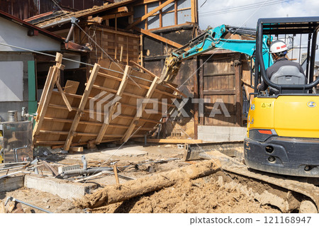 Demolition of an old wooden house 121168947