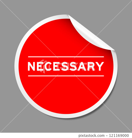 Red color peel sticker label with word necessary on gray background Red color peel sticker label with word necessary on gray background 121169000