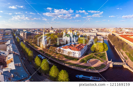 Aerial top view to St. Nicholas Naval Sea Cathedral. Panorama of evening historical city center - Semimostye. Orthodox church located on banks of Kryukov and Griboyedov canal. Saint Petersburg. Russia 121169159