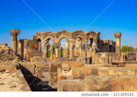 Columns and unique stone ruins of the ancient medieval Zvartnots temple. Vagharshapat Famous landmark constructed in the 7-th century in Armenia. Museum and archaeological site. Yerevan. Europe. 121169185