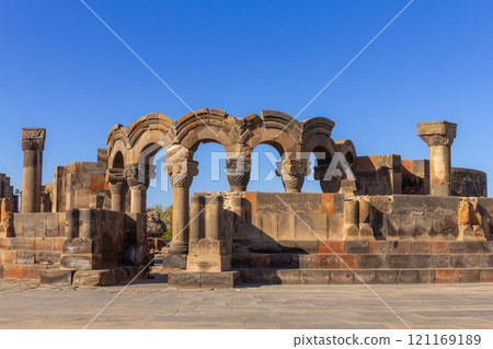 Columns and unique stone ruins of the ancient medieval Zvartnots temple. Vagharshapat Famous landmark constructed in the 7-th century in Armenia. Museum and archaeological site. Yerevan. Europe. 121169189