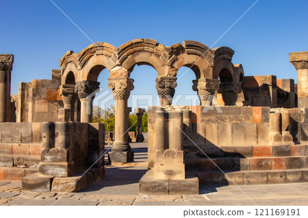 Columns and unique stone ruins of the ancient medieval Zvartnots temple. Vagharshapat Famous landmark constructed in the 7-th century in Armenia. Museum and archaeological site. Yerevan. Europe. 121169191