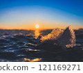 Frosty air and frozen lake surface in a beautiful sunset landscape. Beautiful ice shapes and sunlight. Photo from Sotkamo, Finland. 121169271