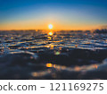 Frosty air and frozen lake surface in a beautiful sunset landscape. Beautiful ice shapes and sunlight. Photo from Sotkamo, Finland. 121169275
