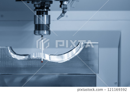 The CMM probe measuring the  mold parts on machining center in the light blue scene. 121169392
