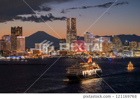 Kanagawa Prefecture: Night view of Yokohama Minato Mirai and a departing cruise ship Kanagawa Prefecture: Night view of Yokohama Minato Mirai and a departing cruise ship 121169768