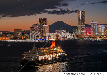 Kanagawa Prefecture: Night view of Yokohama Minato Mirai and a departing cruise ship Kanagawa Prefecture: Night view of Yokohama Minato Mirai and a departing cruise ship 121169772